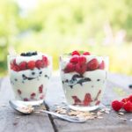 Natural yogurt with fresh raspberries, black currant and muesli.